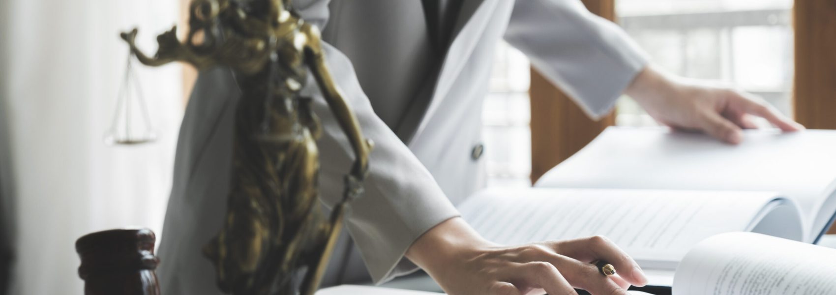 Business woman in suit or lawyer working on a documents. Legal law, advice and justice concept.